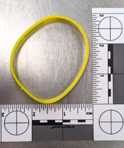 A yellow wrist band with a ruler to show scale