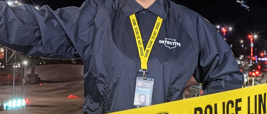 crime scene with a detective wearing an id lanyard
